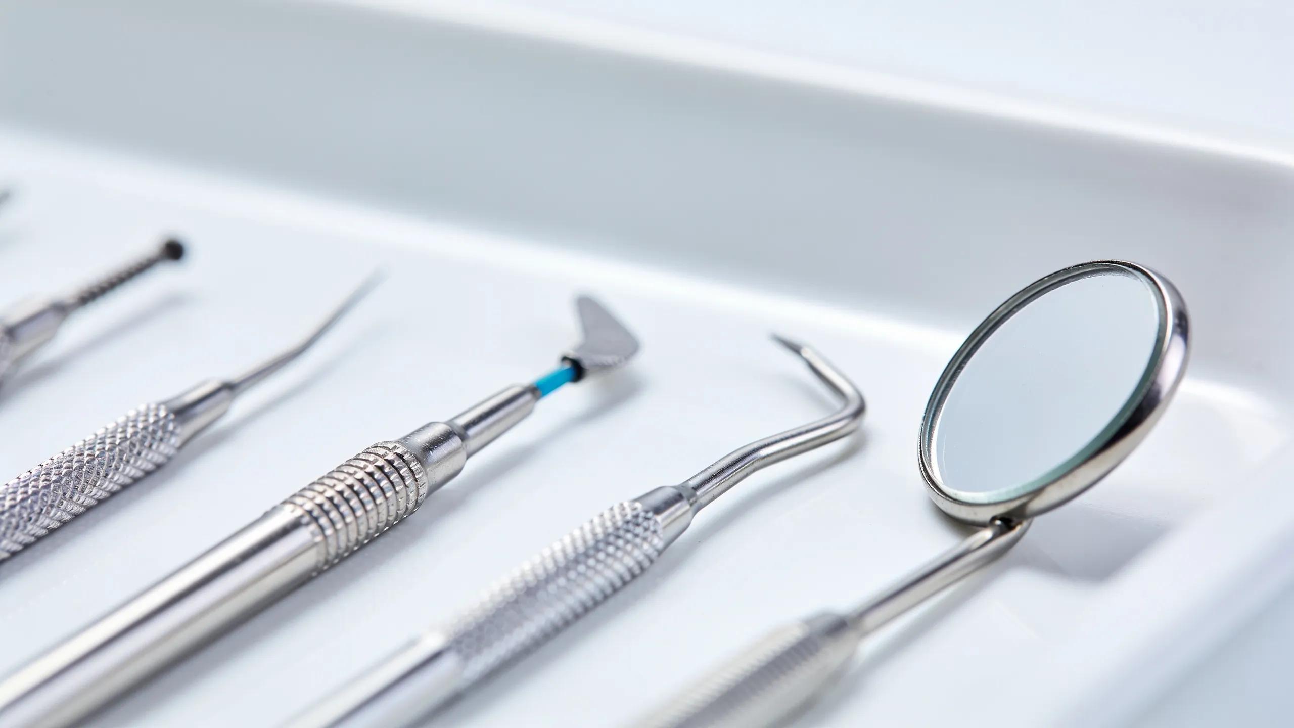 Close-up of advanced endodontic tools used in root canal therapy on a dental tray