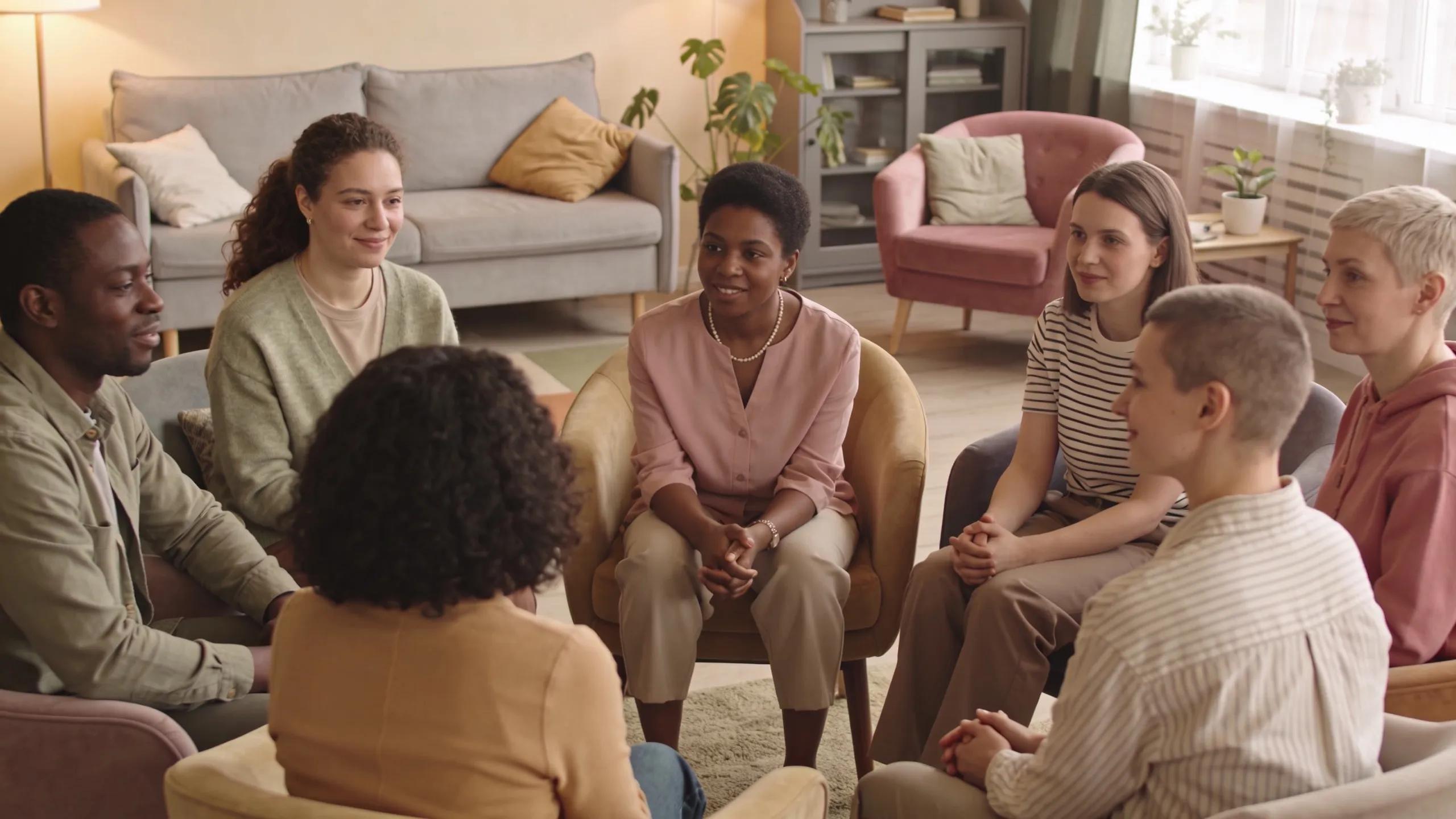 Group therapy session illustrating mental health support services provided by community programs